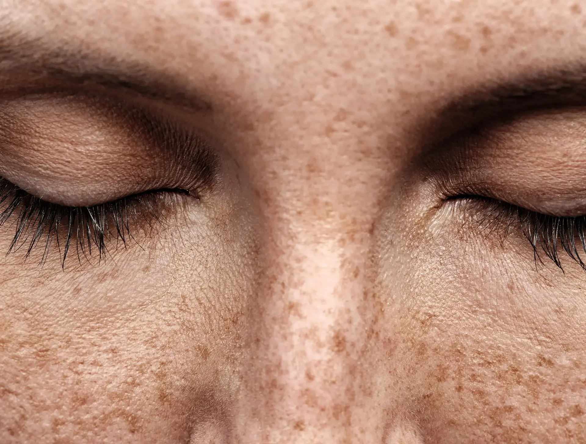 woman with eyes closed meditating